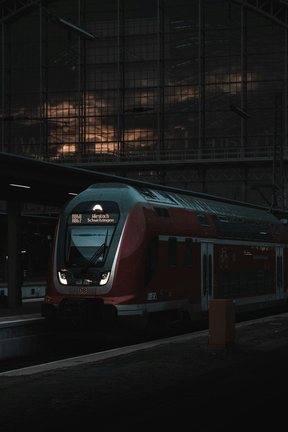 red and black train on train station during daytime