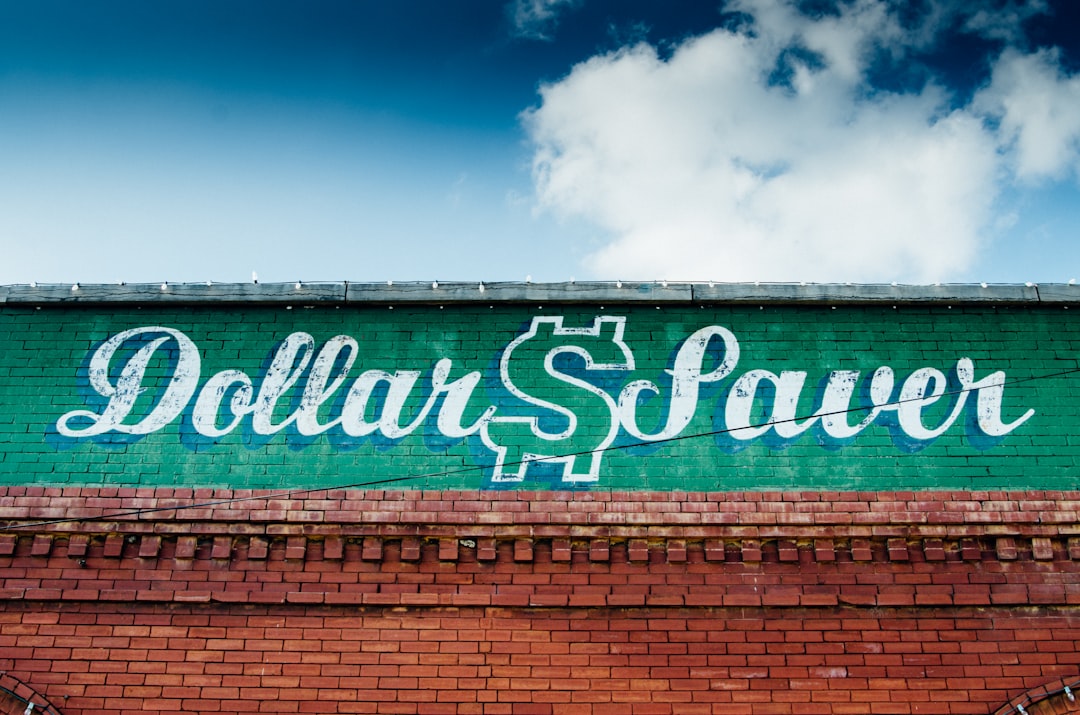 green and white wooden signage, Old building with vintage signage with skyline.<p></figure>