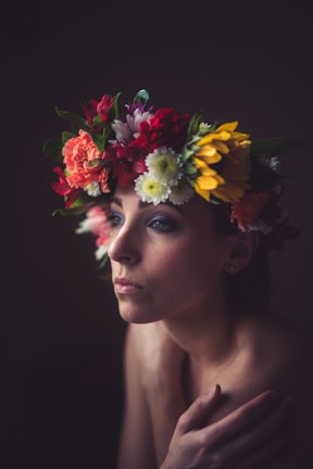 Bold floral crown featuring vibrant colors and delicate textures against a neutral background