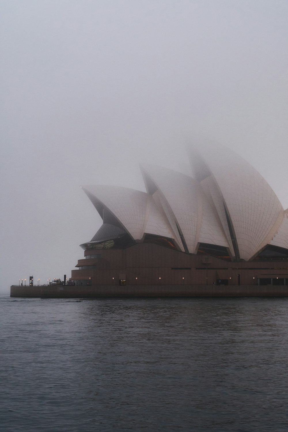 sydney opera house near body of water during daytime