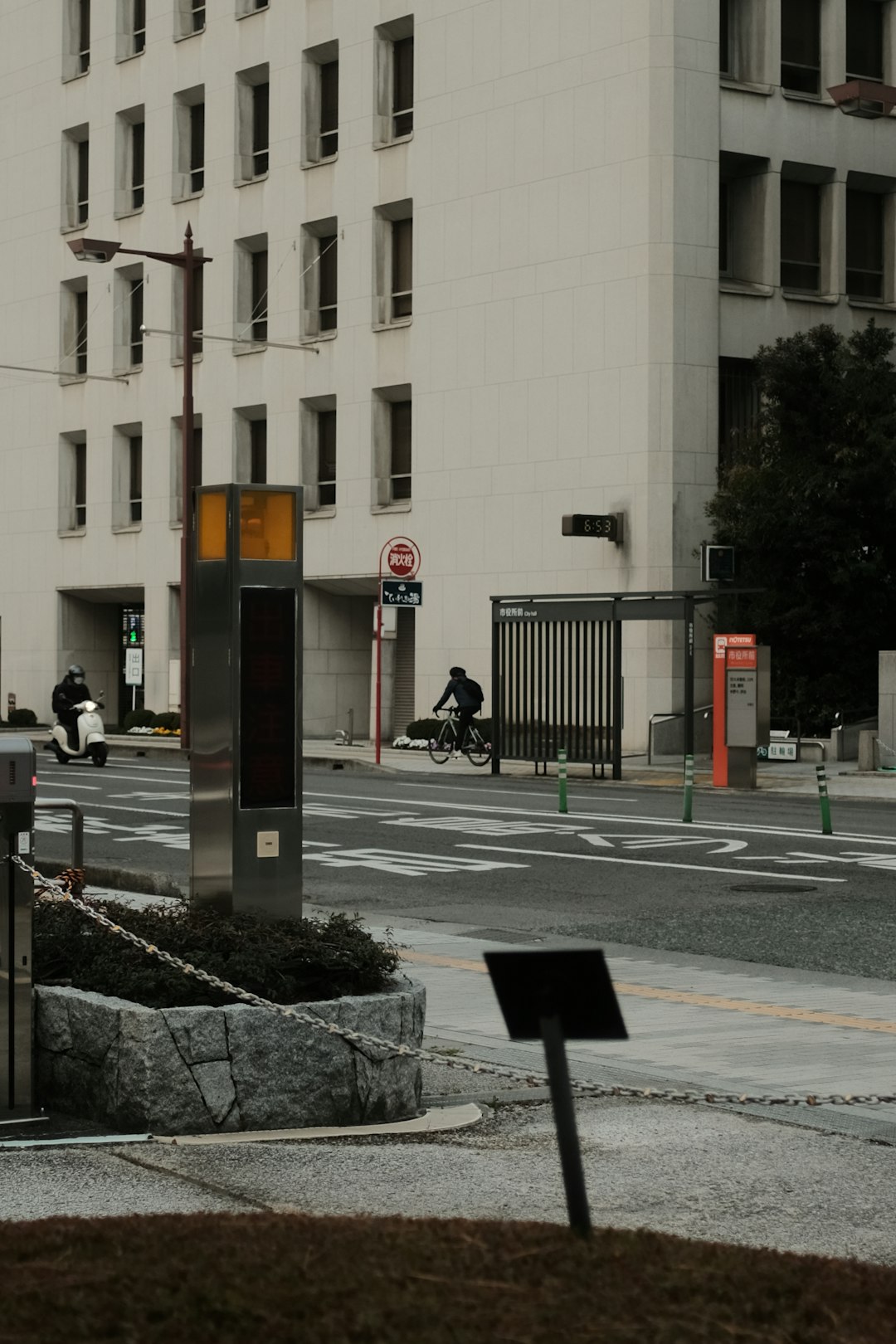 people walking on sidewalk near building during daytime