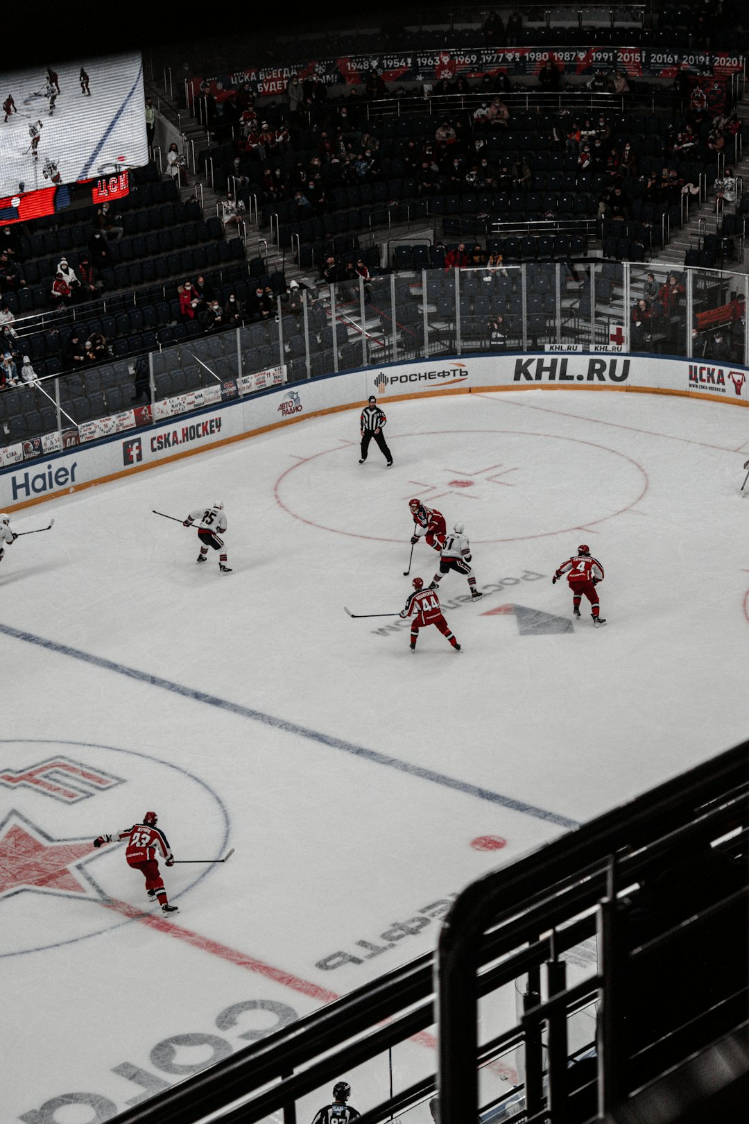 people playing ice hockey on ice stadium