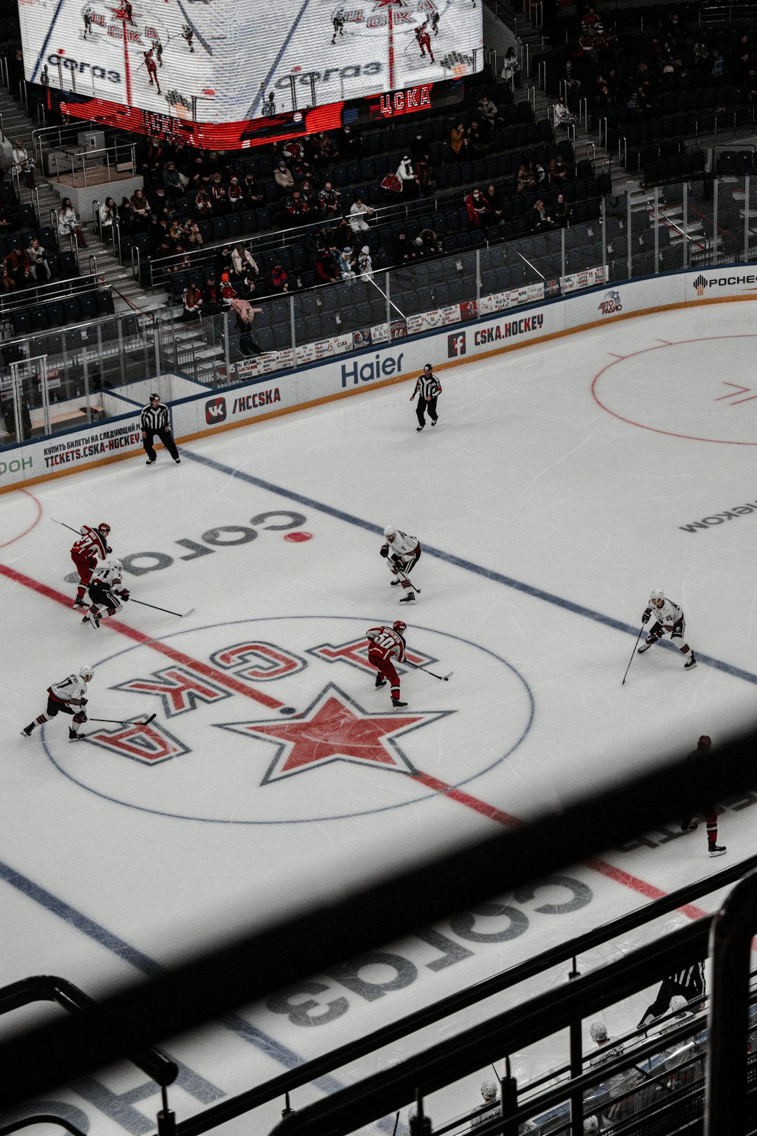 people playing ice hockey on stadium