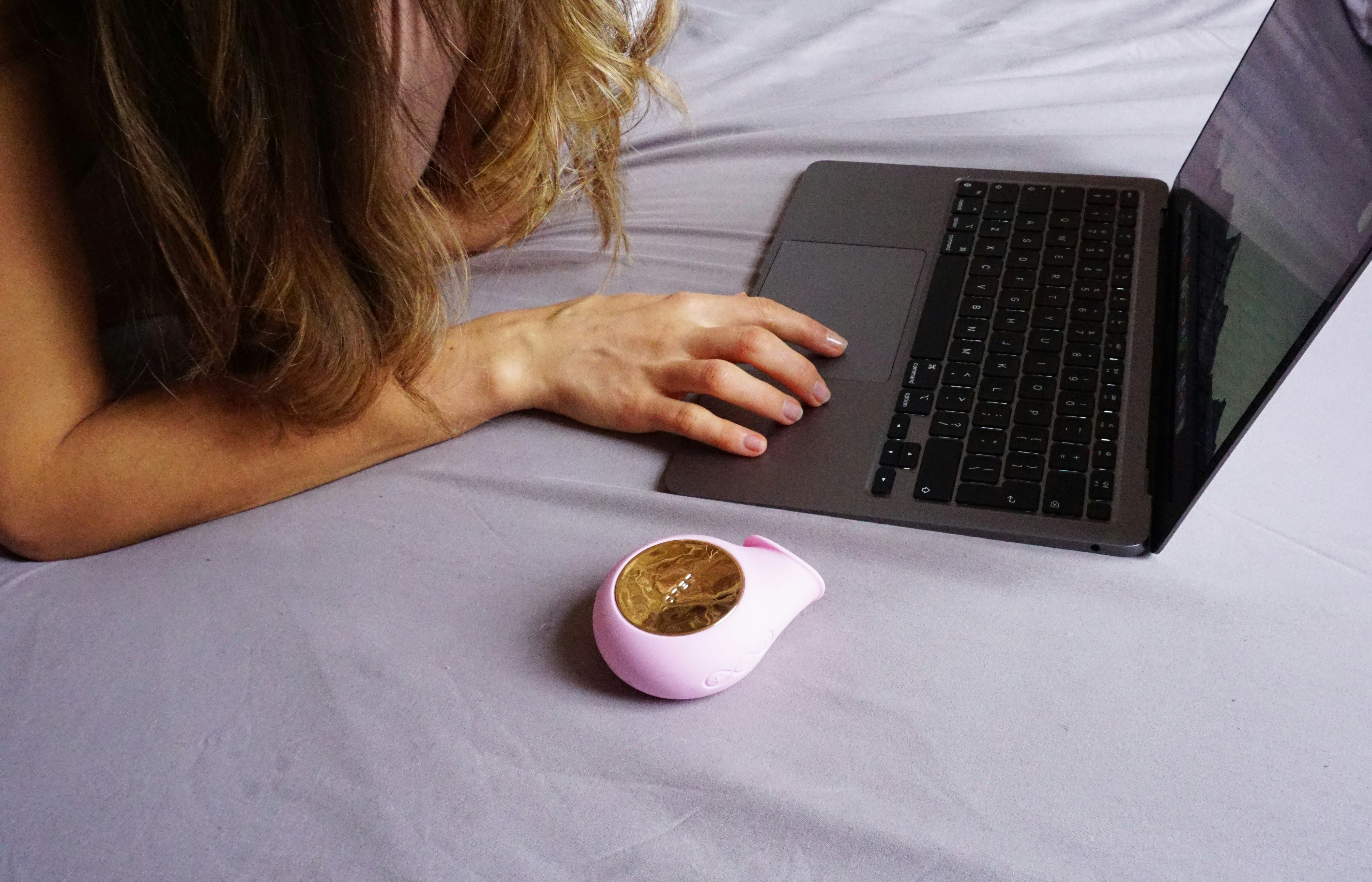 woman in white long sleeve shirt holding white ceramic mug with coffee
