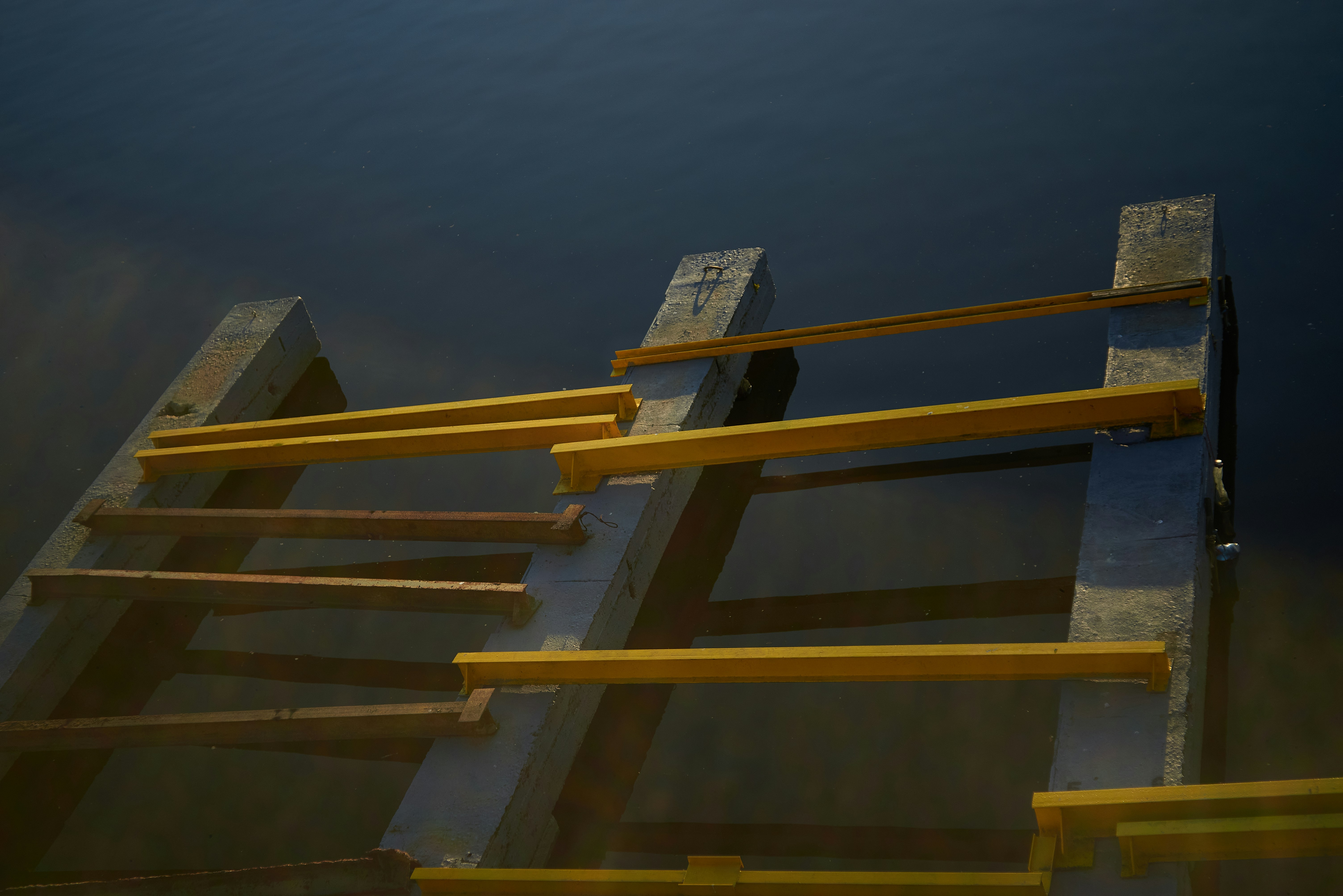 white and black labeled box on brown wooden staircase
