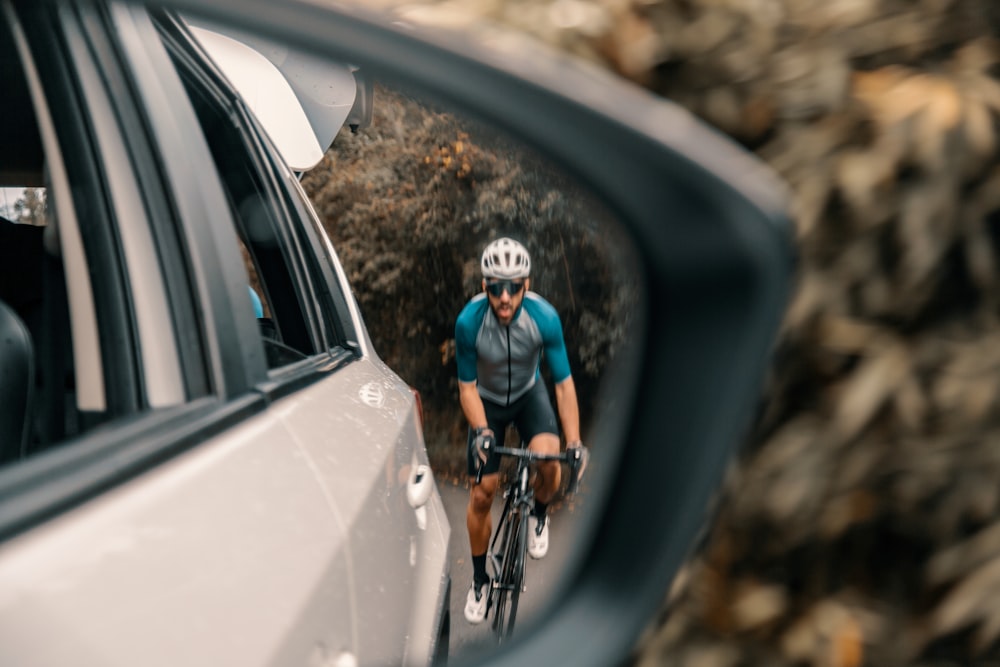 man in black t-shirt riding bicycle