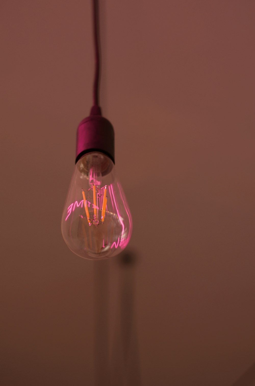 pink and black light bulb