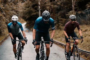 2 men riding on bicycle