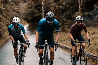 2 men riding on bicycle
