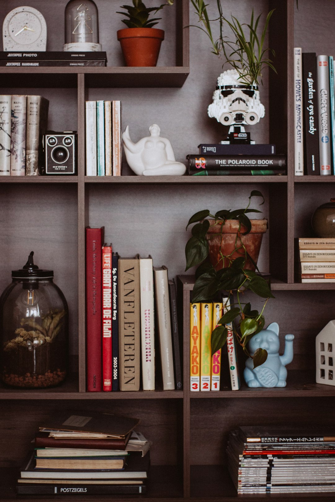  clear glass jar on white wooden shelf bookcase