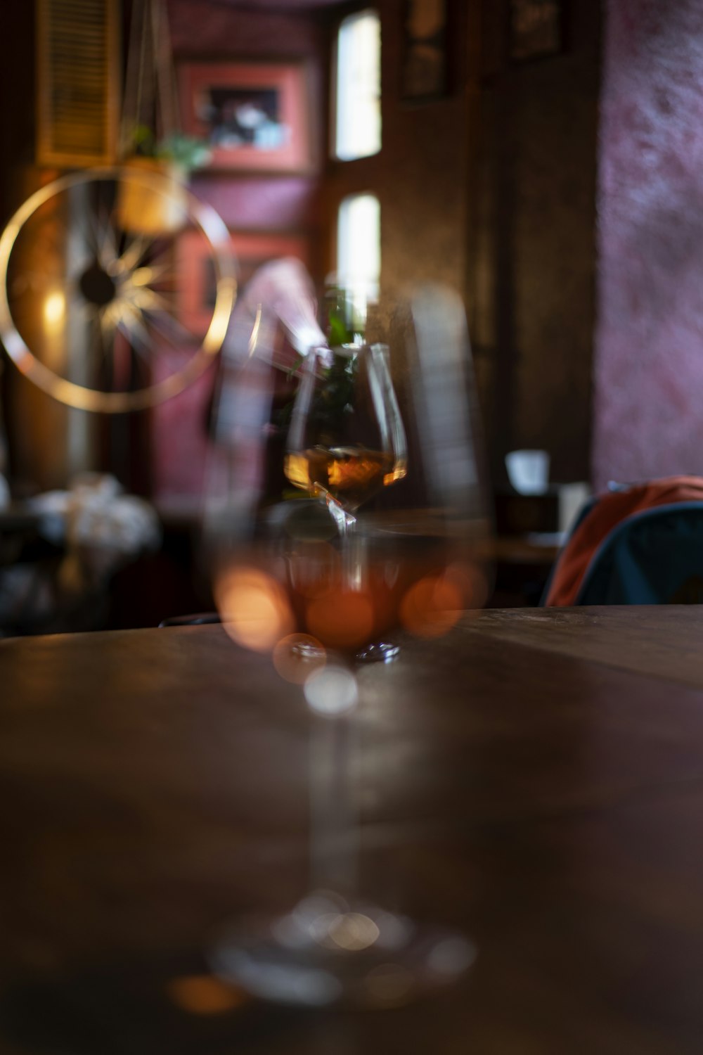 clear wine glass on brown wooden table