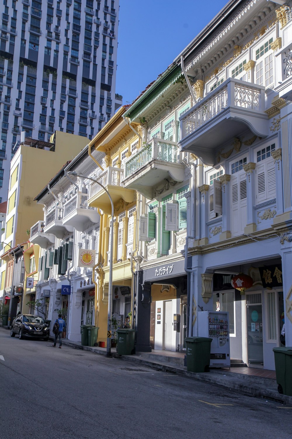 cars parked in front of white building during daytime