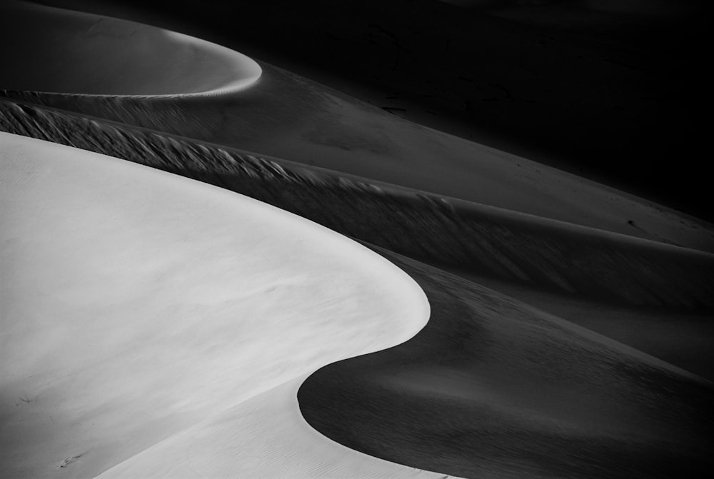 grayscale photo of a spiral staircase