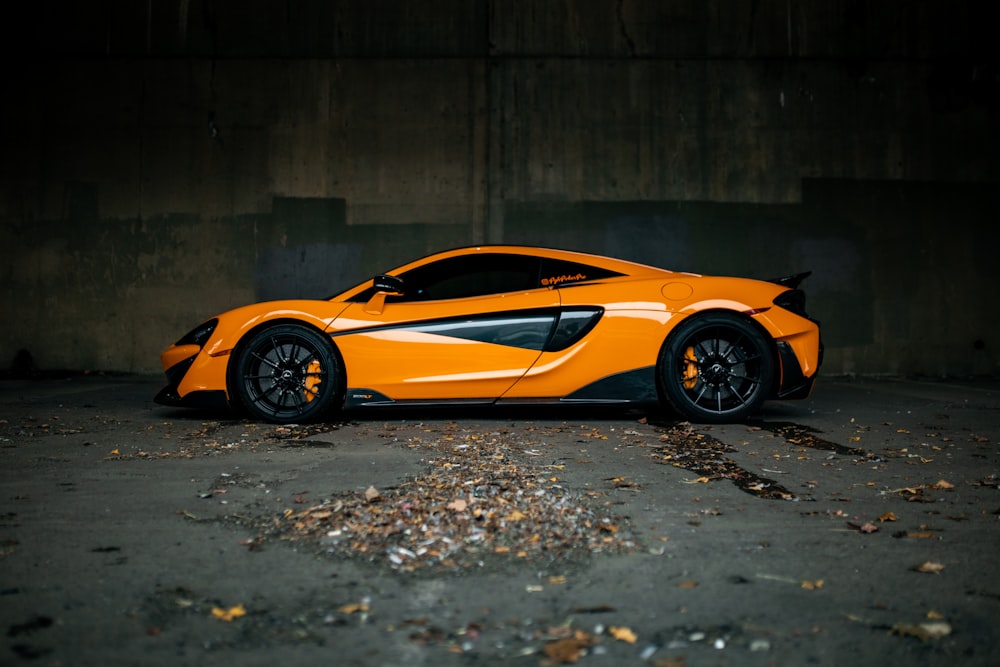 yellow lamborghini aventador parked on gray concrete floor