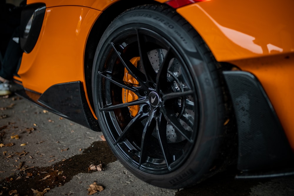 black and silver wheel on yellow car