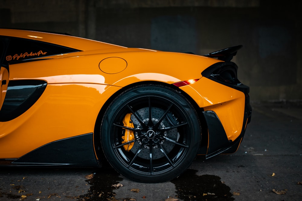 yellow ferrari car in a black room