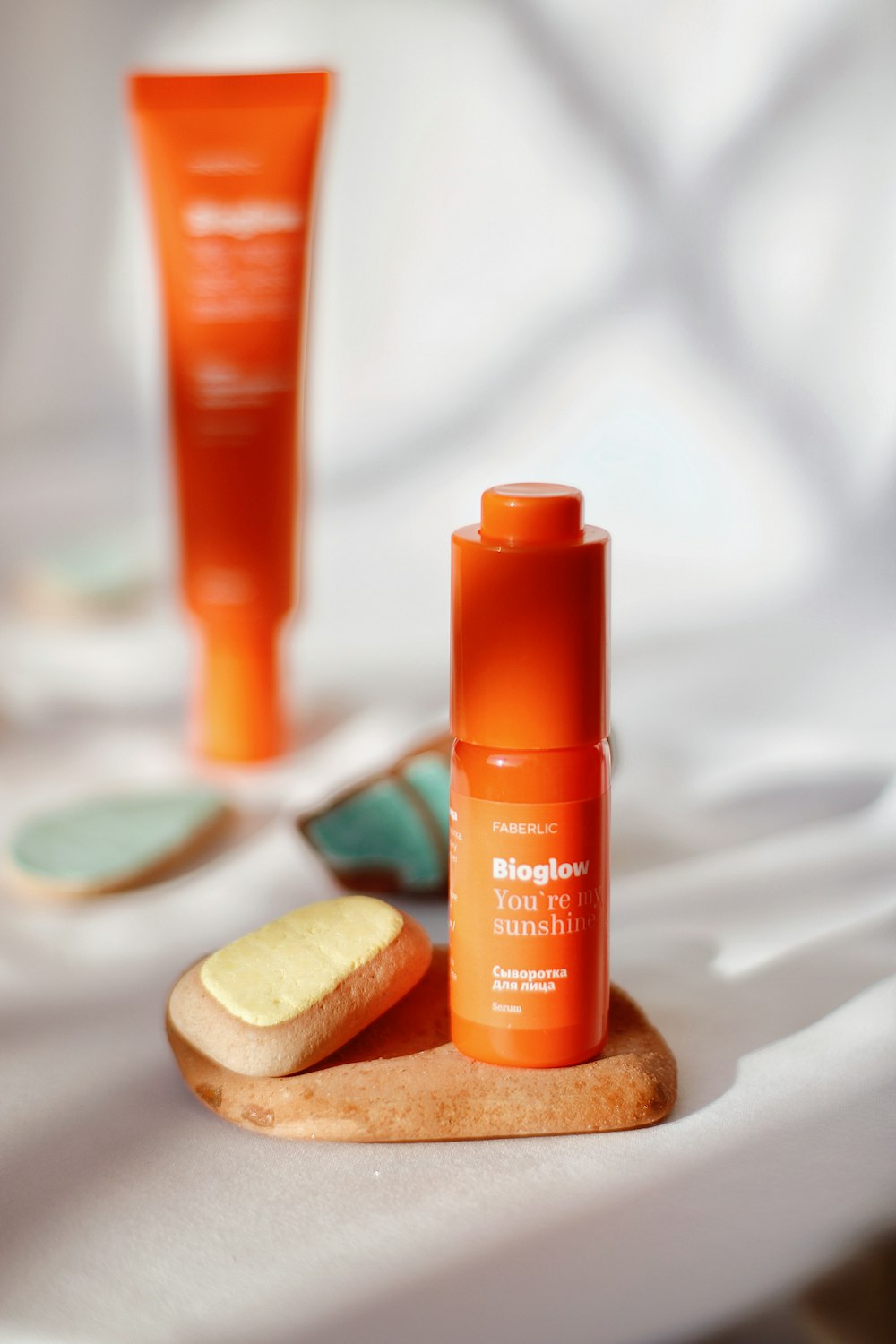 a bottle of sunscreen next to a bottle of sunscreen on a table