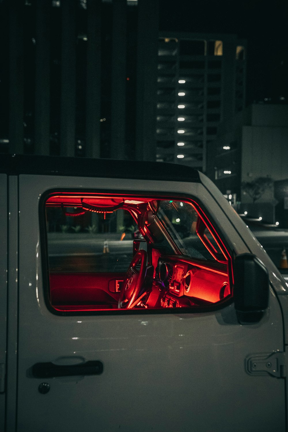 red car in a parking lot