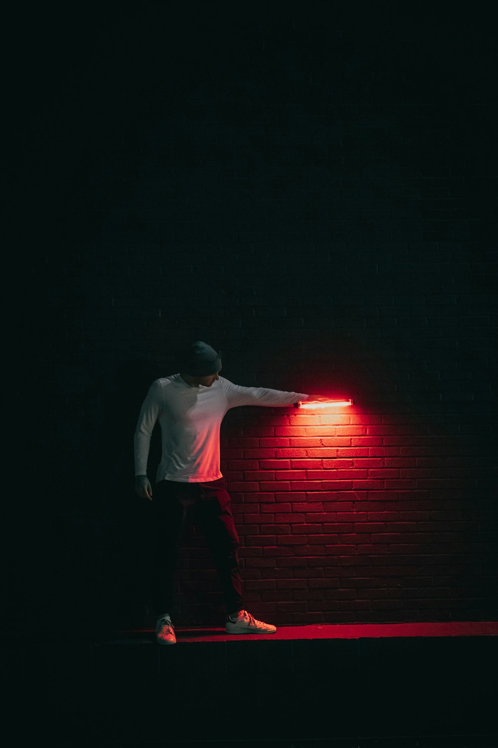 man in white shirt standing on stage