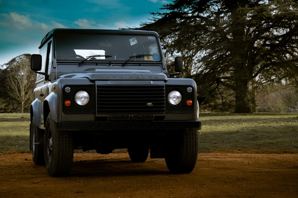 black jeep wrangler on dirt road during daytime