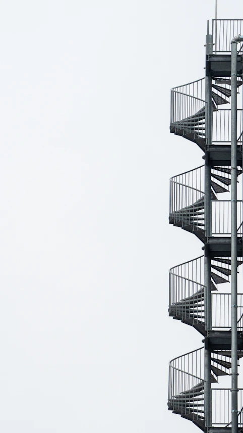 white spiral stairs with white background