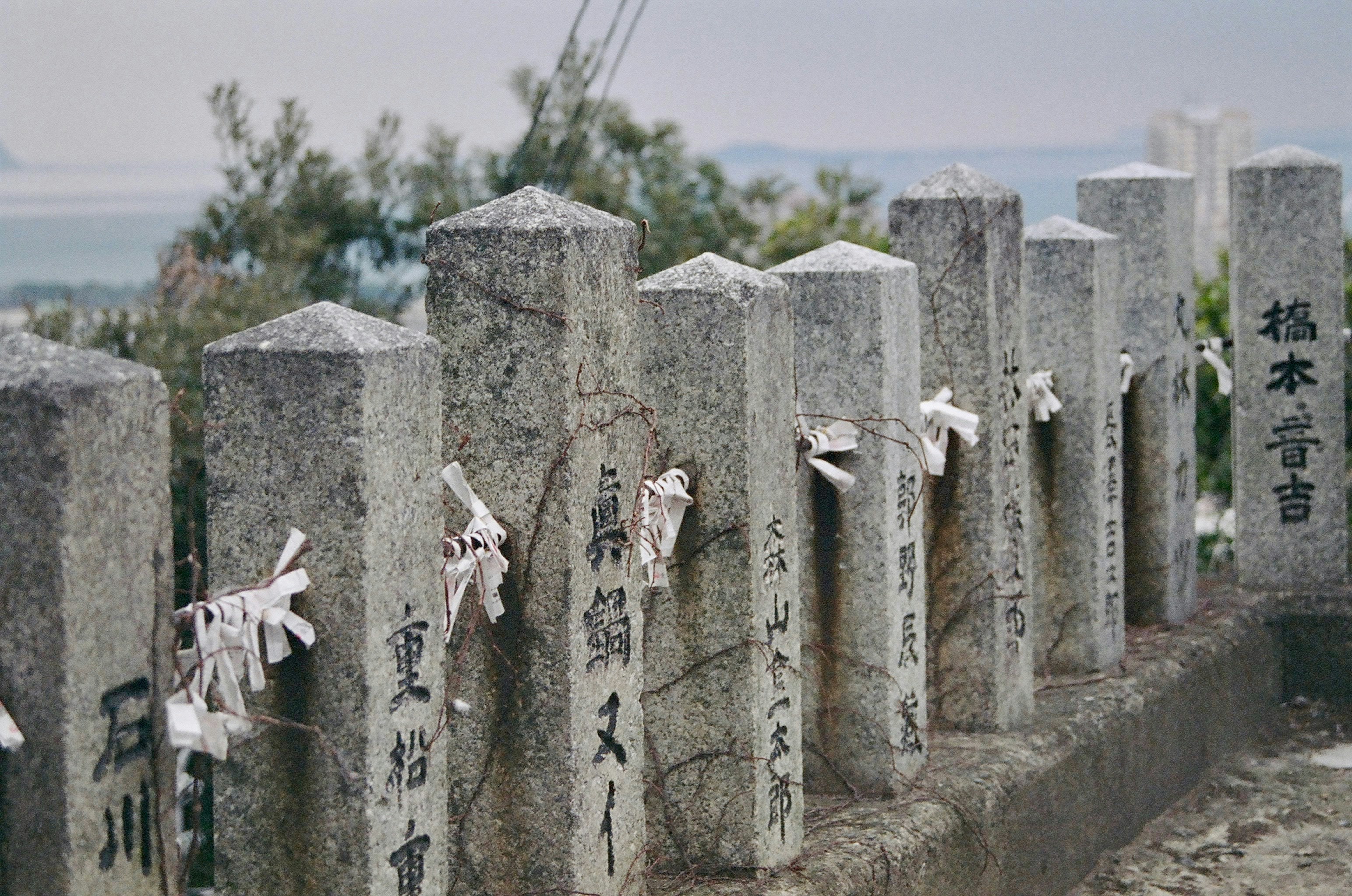 white and black cross on gray concrete wall
