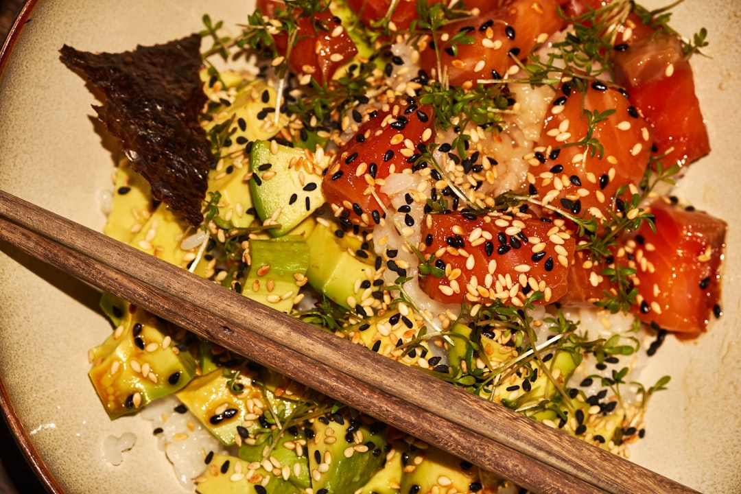 brown wooden chopsticks on green vegetable