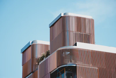 Brown concrete building with repeating geometric windows