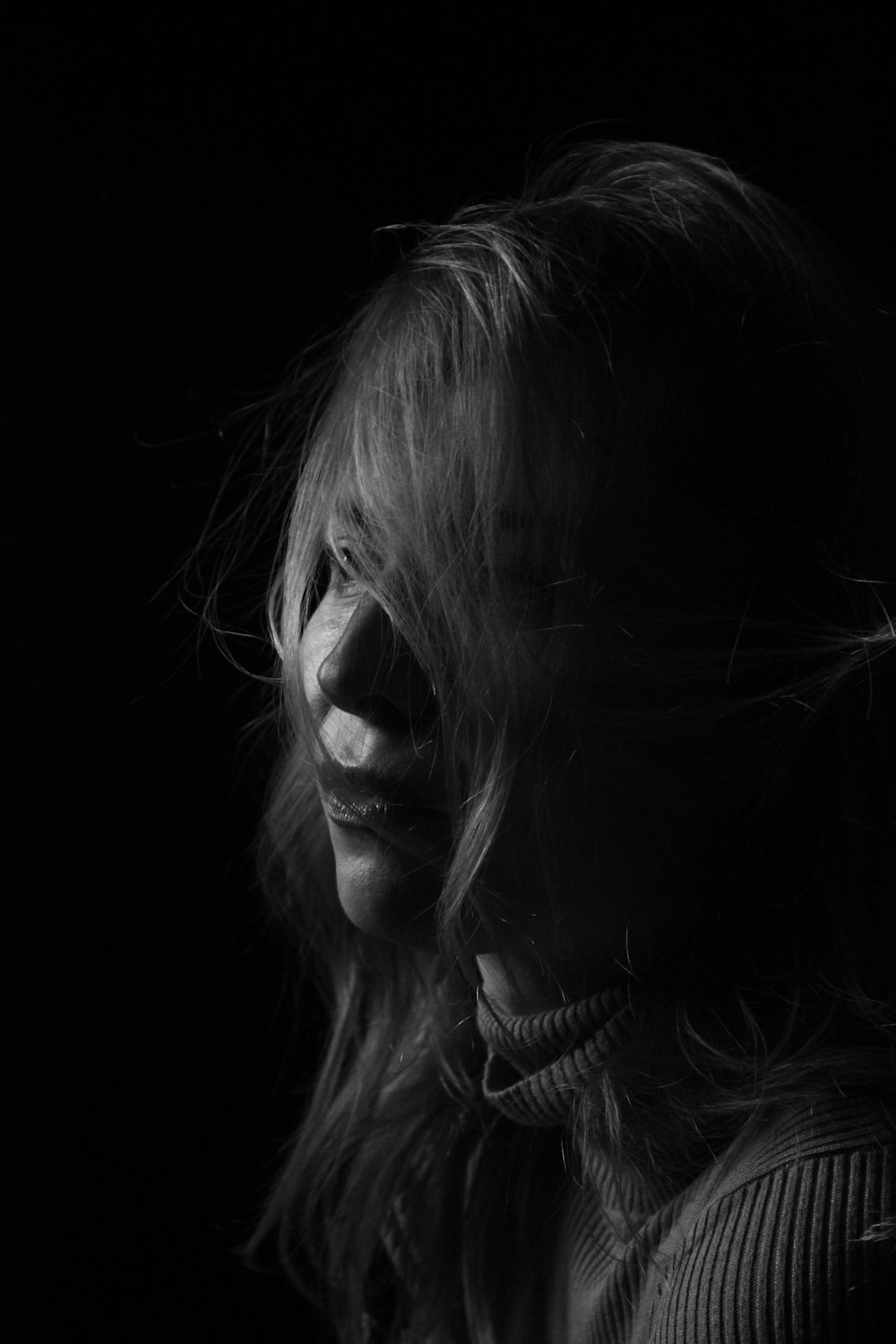 grayscale photo of womans face