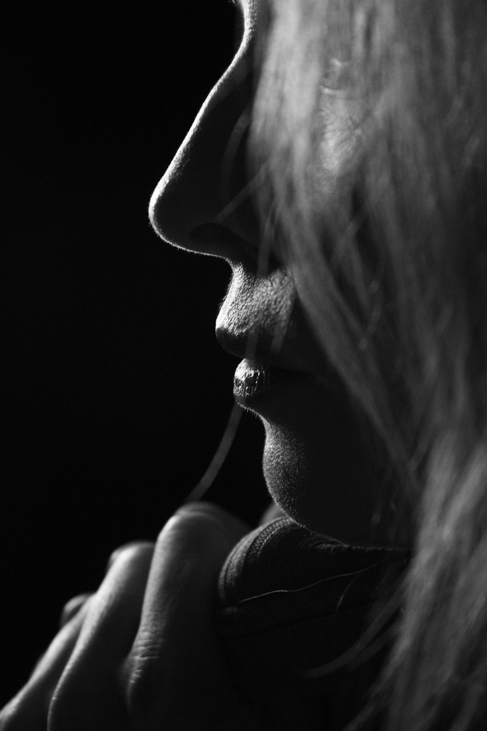 grayscale photo of woman kissing mans cheek