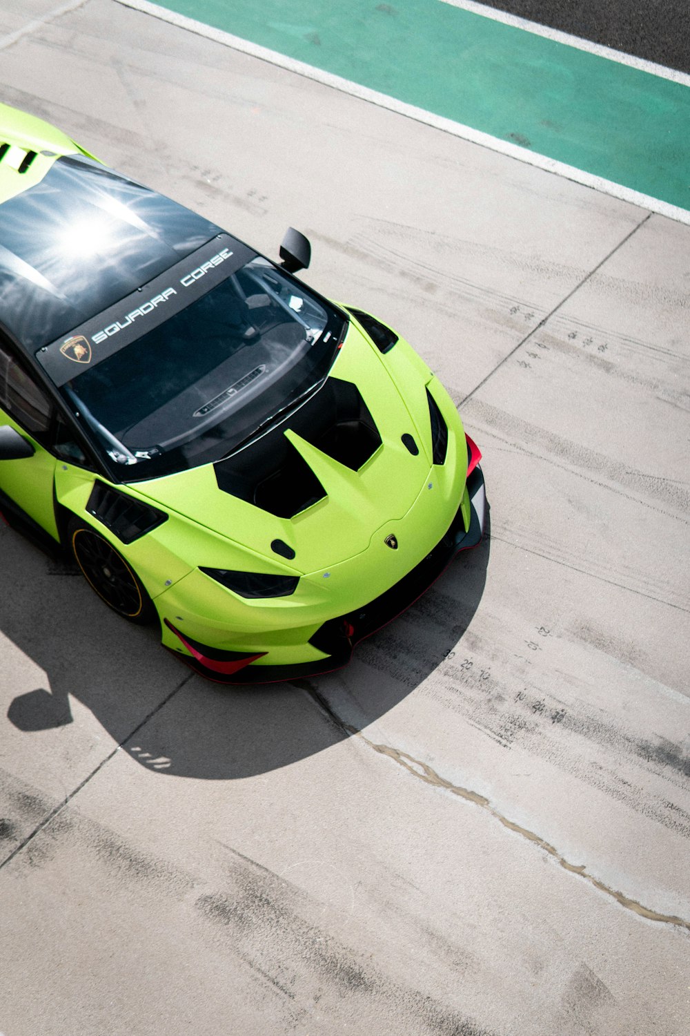 yellow and black lamborghini aventador on road