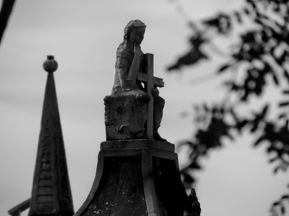 grayscale photo of statue of man