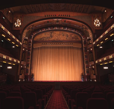 brown wooden chairs inside theater