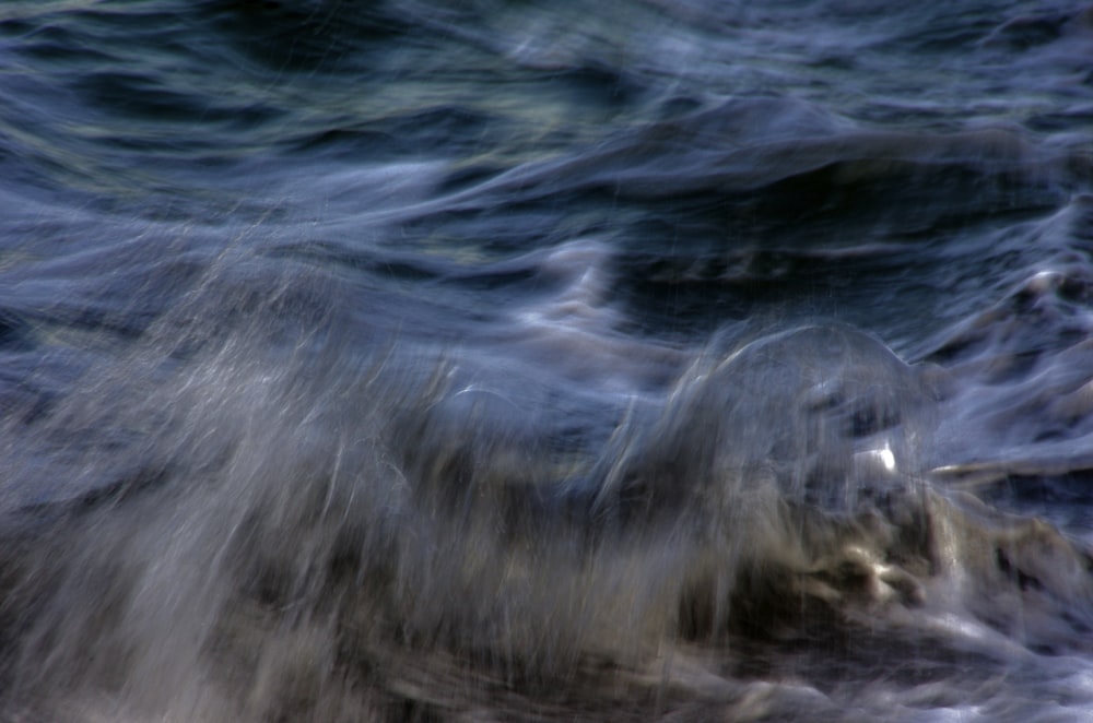 a blurry photo of the ocean waves