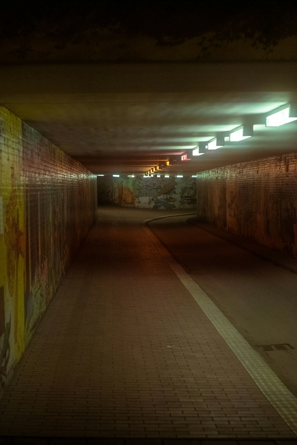 empty hallway with lighted ceiling lamps