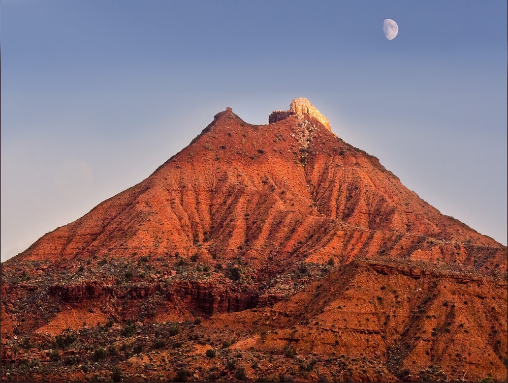 brown rocky mountain under blue sky during daytime