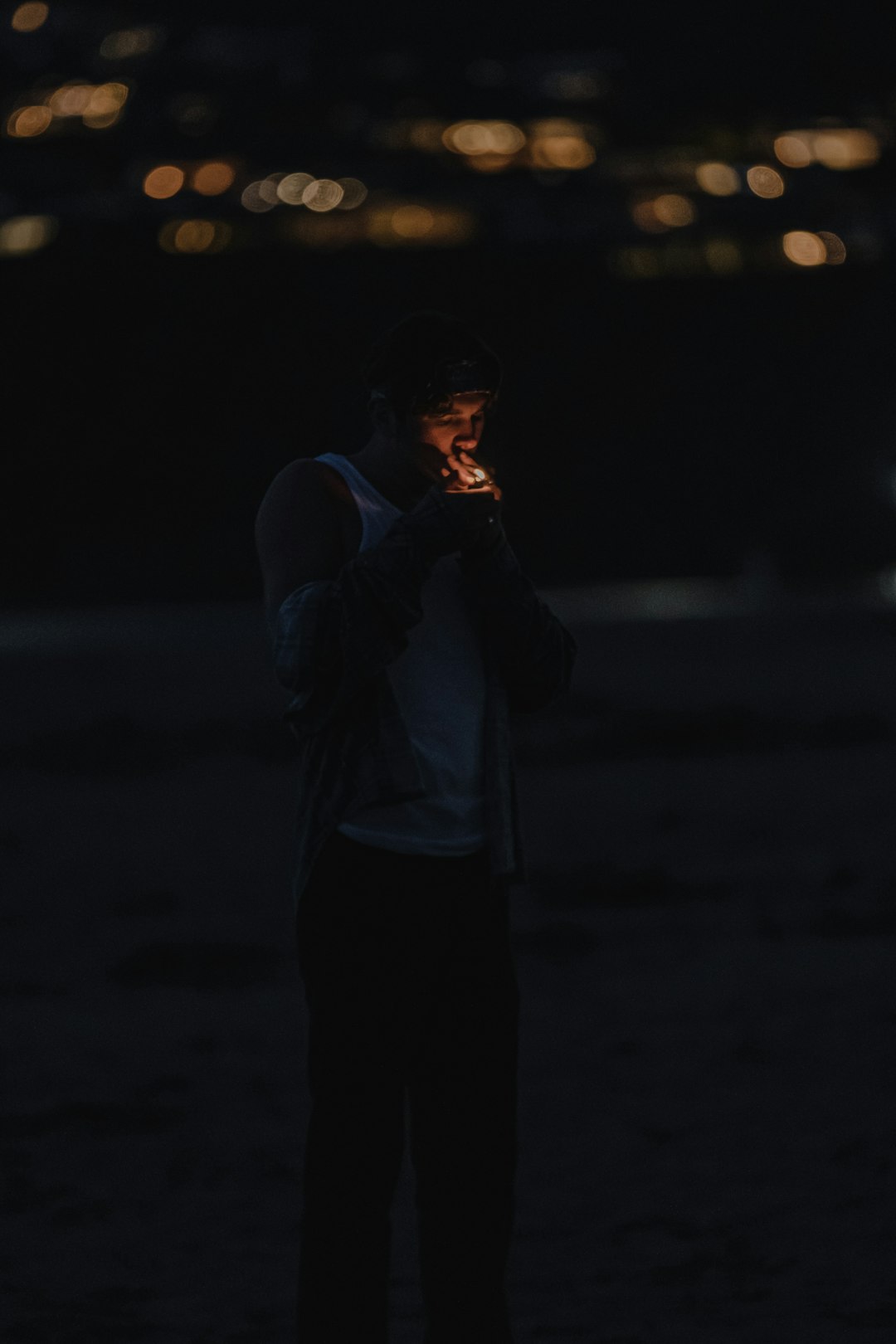 man in white dress shirt smoking cigarette