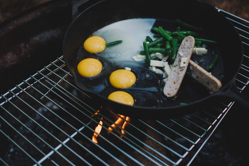 sliced vegetables on black frying pan