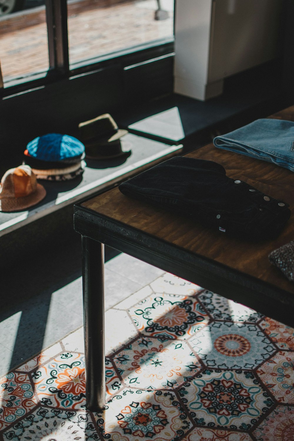 black smartphone on brown wooden table