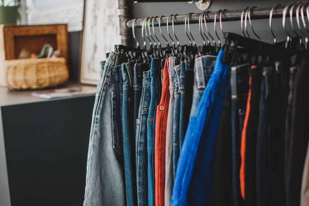 gray denim jeans on clothes hanger