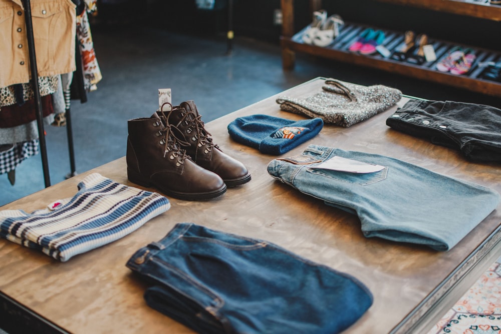 blue textile beside black leather boots