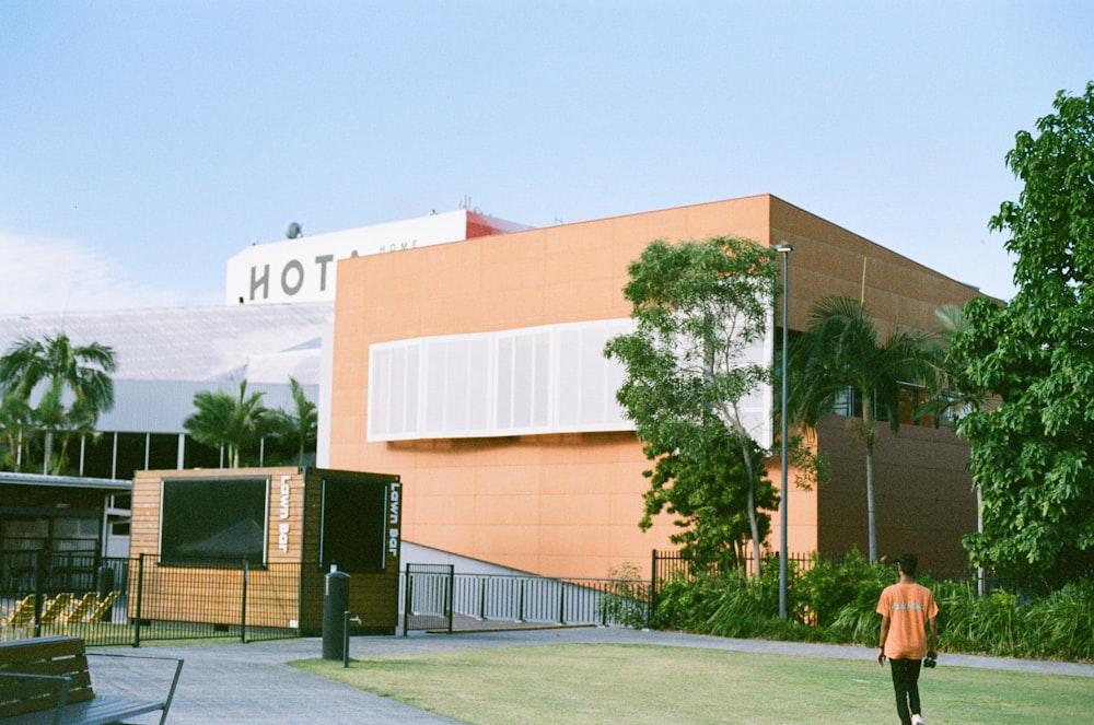 brown concrete building near green grass field during daytime