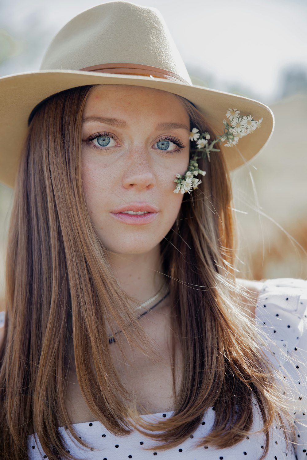 woman in white floral headband