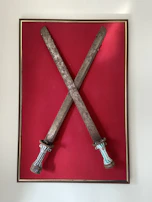 Close-up of the blindfold and swords emphasizing the theme of indecision and protection.