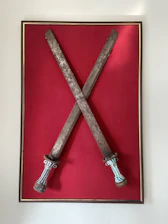 A blacklight poster style illustration of swords crossed under a glowing full moon with a shadowy crowd.