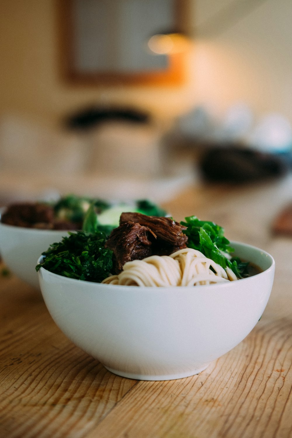 white ceramic bowl with green vegetable dish