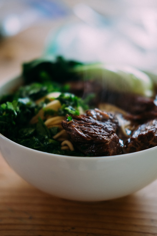 Cooked food in white ceramic bowl
