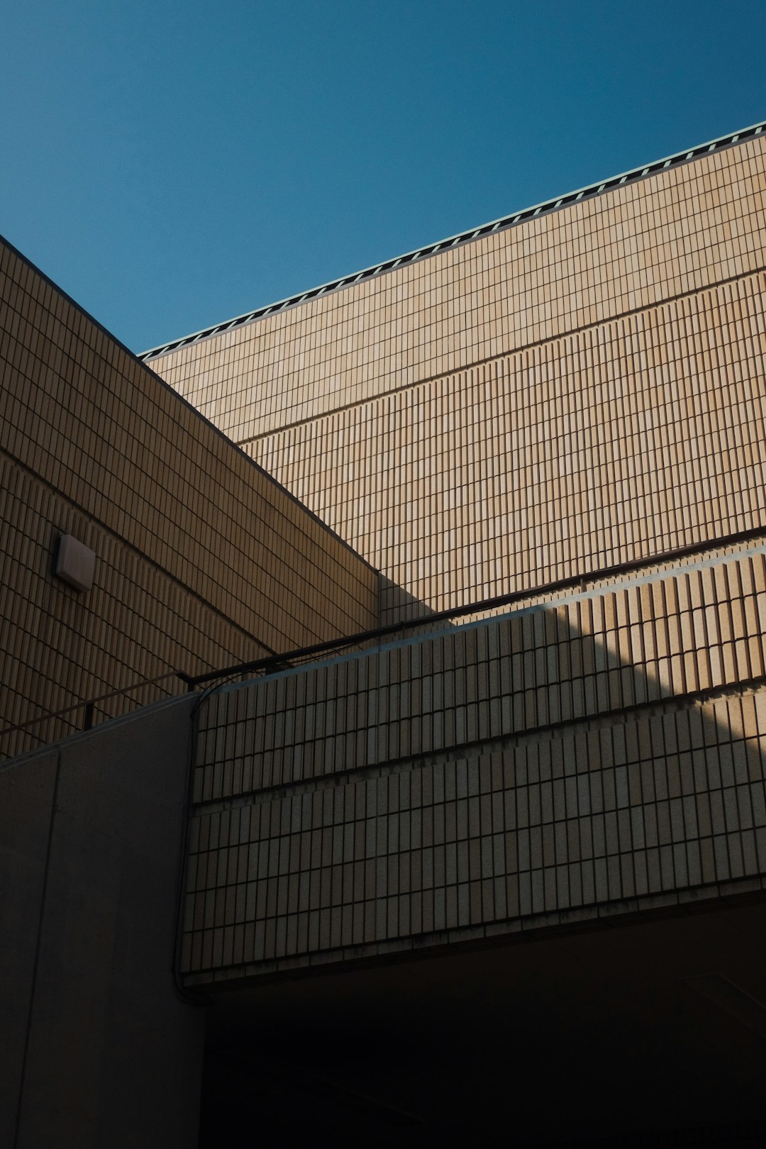 brown and white concrete building under blue sky during daytime