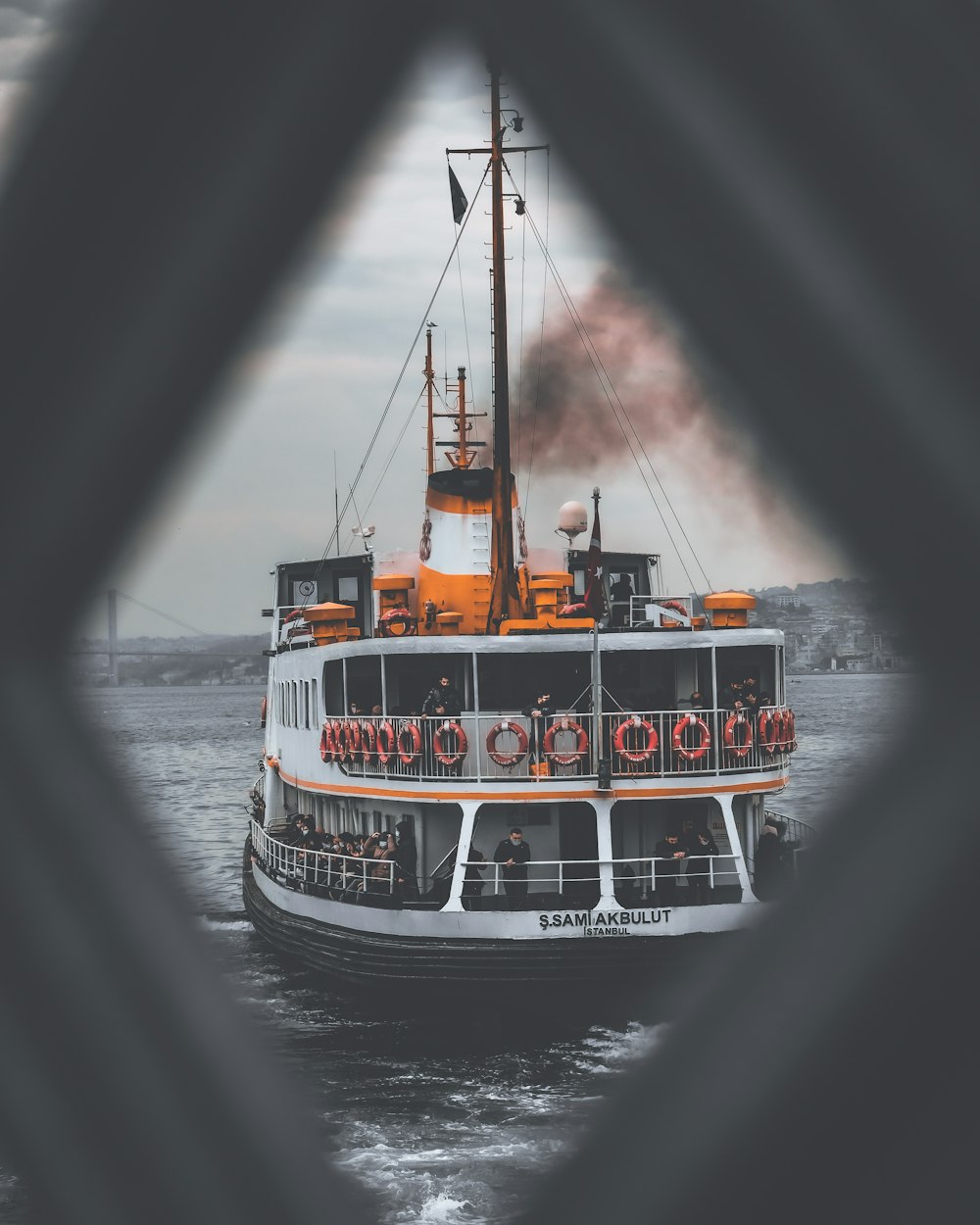 white and black boat on sea during daytime