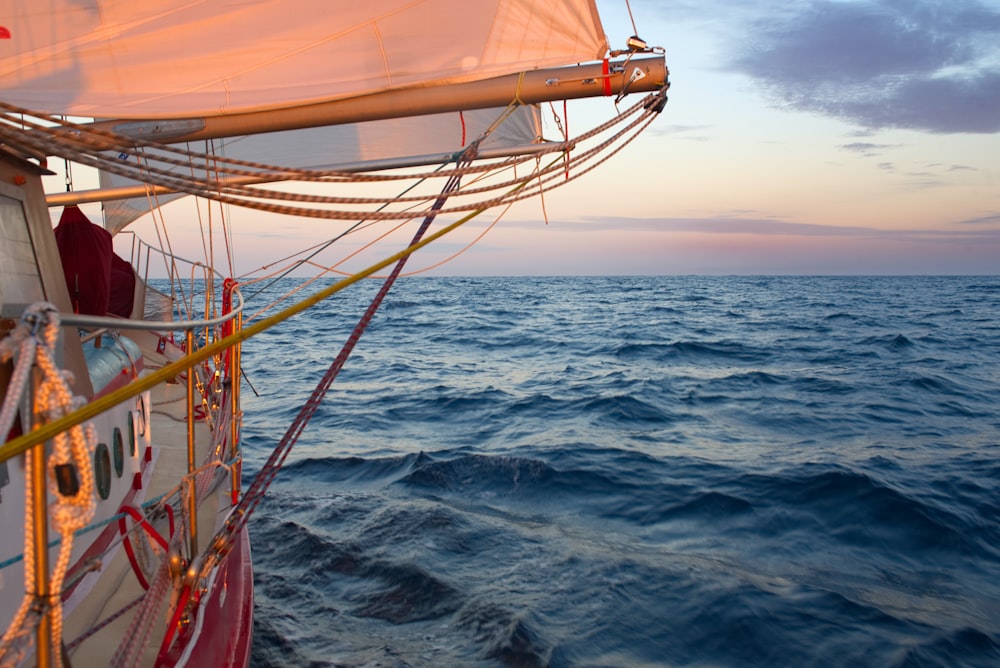 brown and white sail boat on sea during daytime